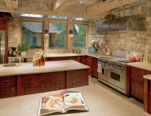 Stone walls and hand hewn beams make this kitchen - Rustic kitchens