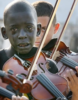 12 year old Brazilian playing the violin at his teacher’s funeral