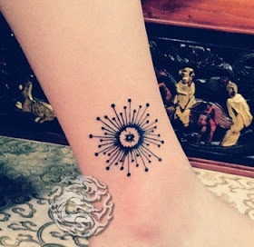 Abstract dandelion tattoo