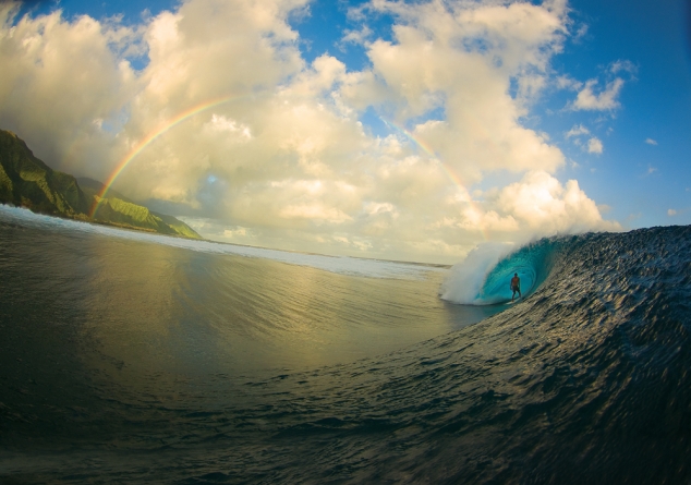 A perfect moment surfing at Teahupoo