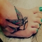 Colorful bird tattoo on foot - Tattoos